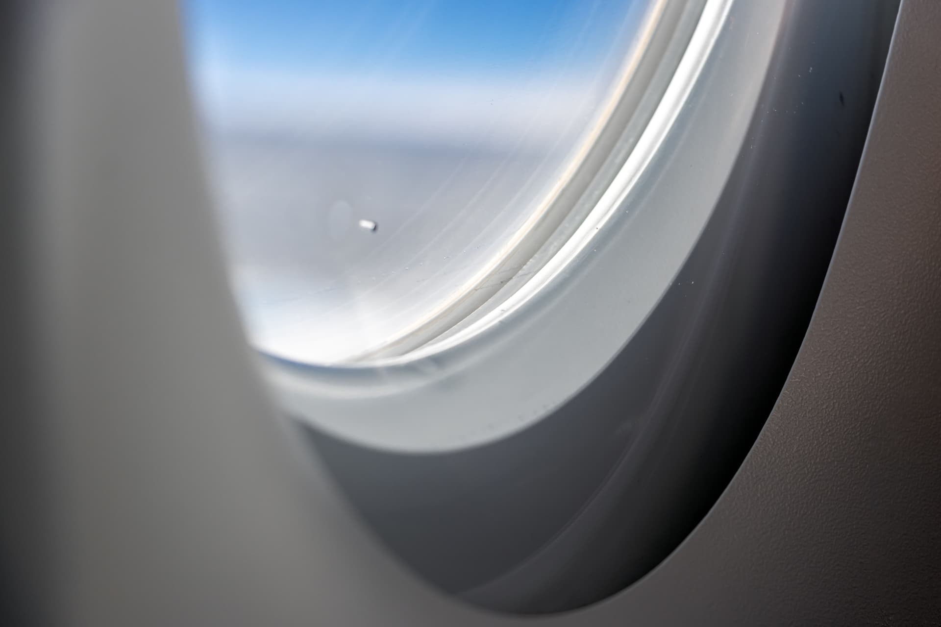 Airplane window with small hole illustration